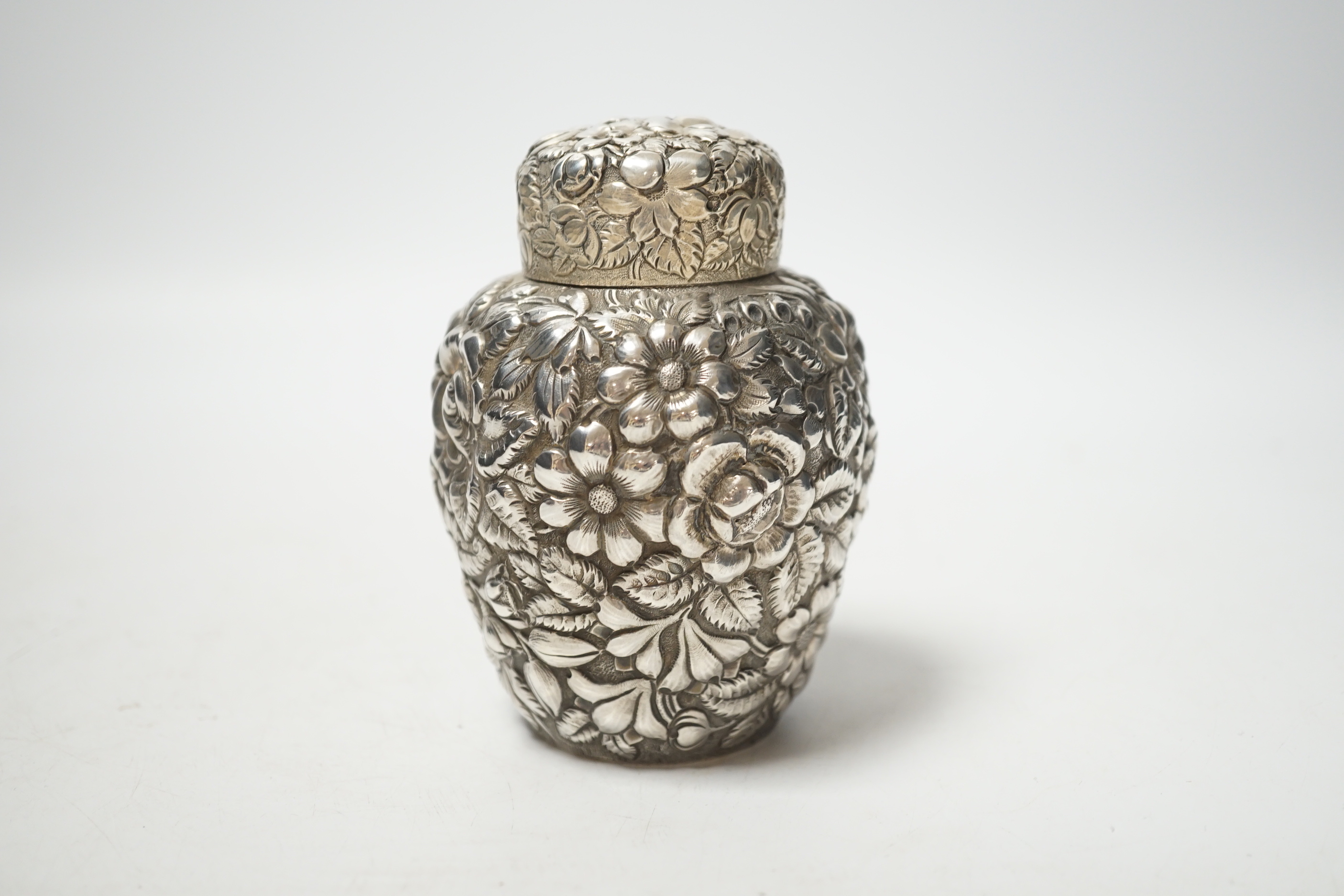 An early 20th century American Galt Bros. sterling tea caddy, embossed with flowers, 10.3cm, 4.7oz.